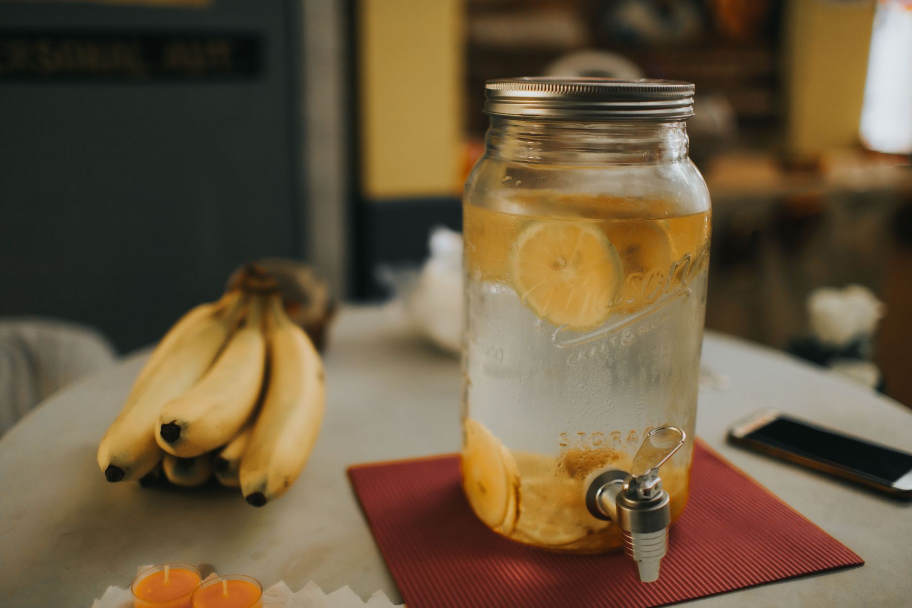 Clear glass gallon water jugs stored in dark for emergency storage