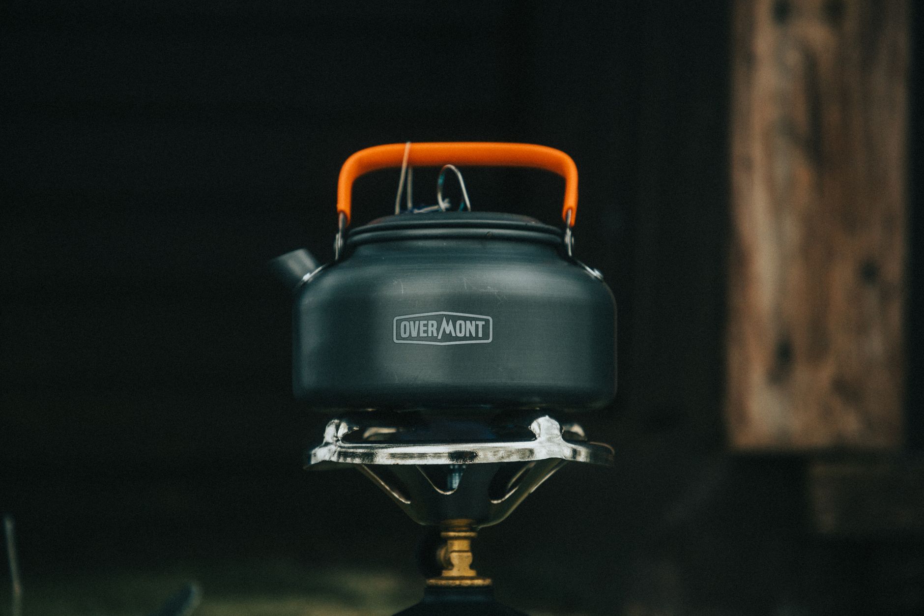 Camping shower system with portable propane tankless water heater by a tent