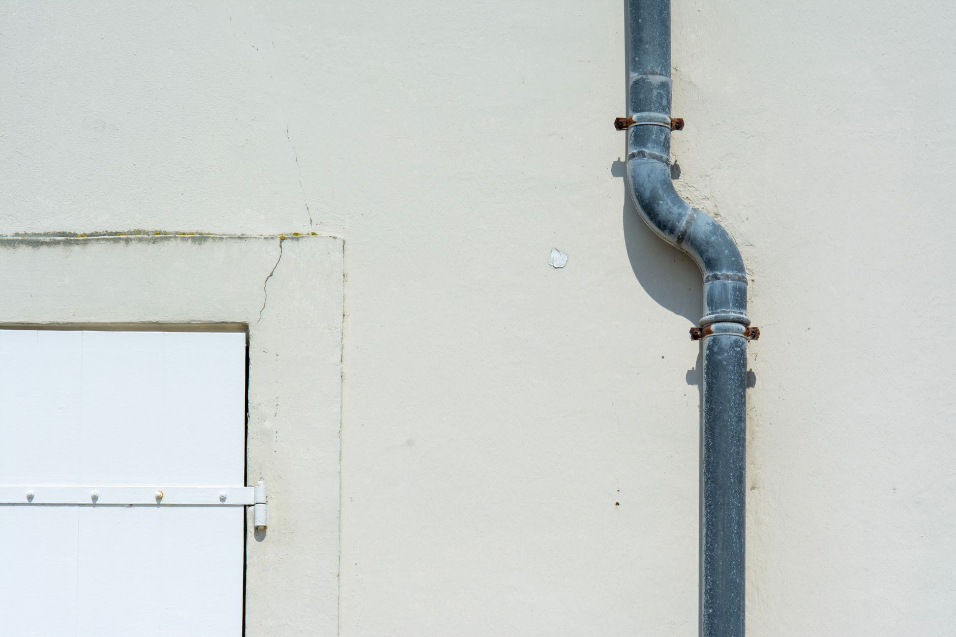 A homeowner using a water test kit to check the quality of a private well water sample